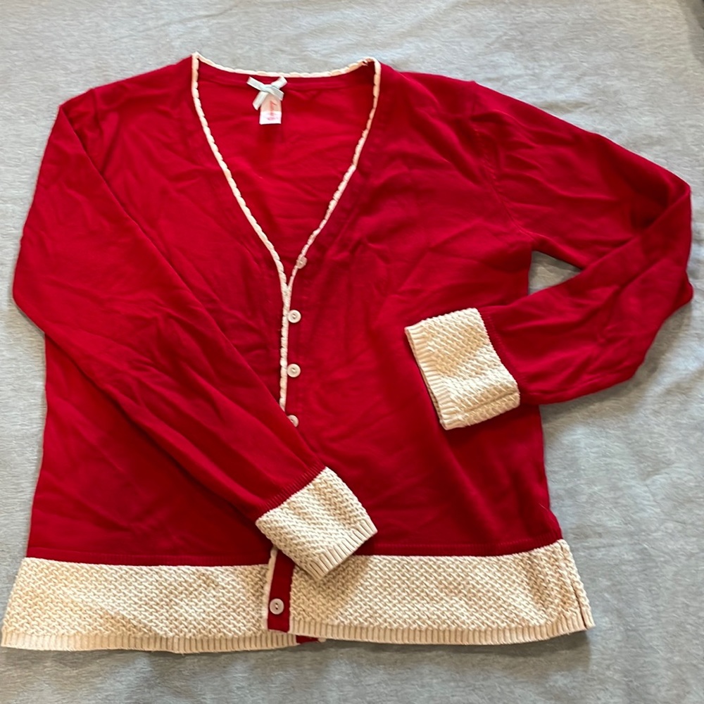 Red and beige cardigan with knit details. Size M